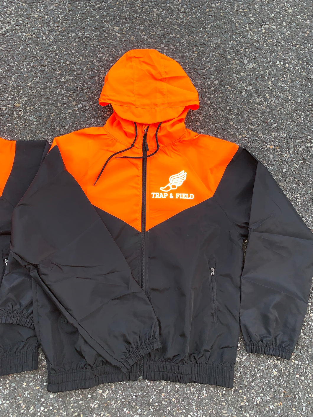 TRAP & FIELD REFLECTIVE WINDBREAKER “NEON ORANGE”